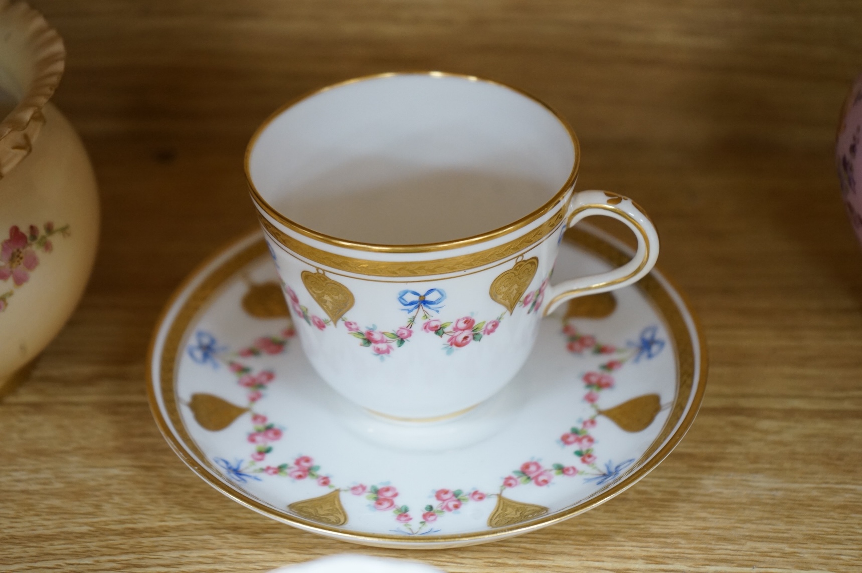A Worcester butterfly handled cup and saucer and four other items, together with Royal Crown Derby, Dresden and Coalport items. (9). Tallest 13 cm
